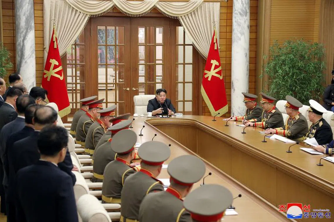 North Korean leader Kim Jong Un meets with commanders of the Korean People's Army, at the headquarters of the Central Committee of the Party, in Pyongyang, North Korea, in this picture released by the Korean Central News Agency on January 1, 2024.  KCNA via REUTERS