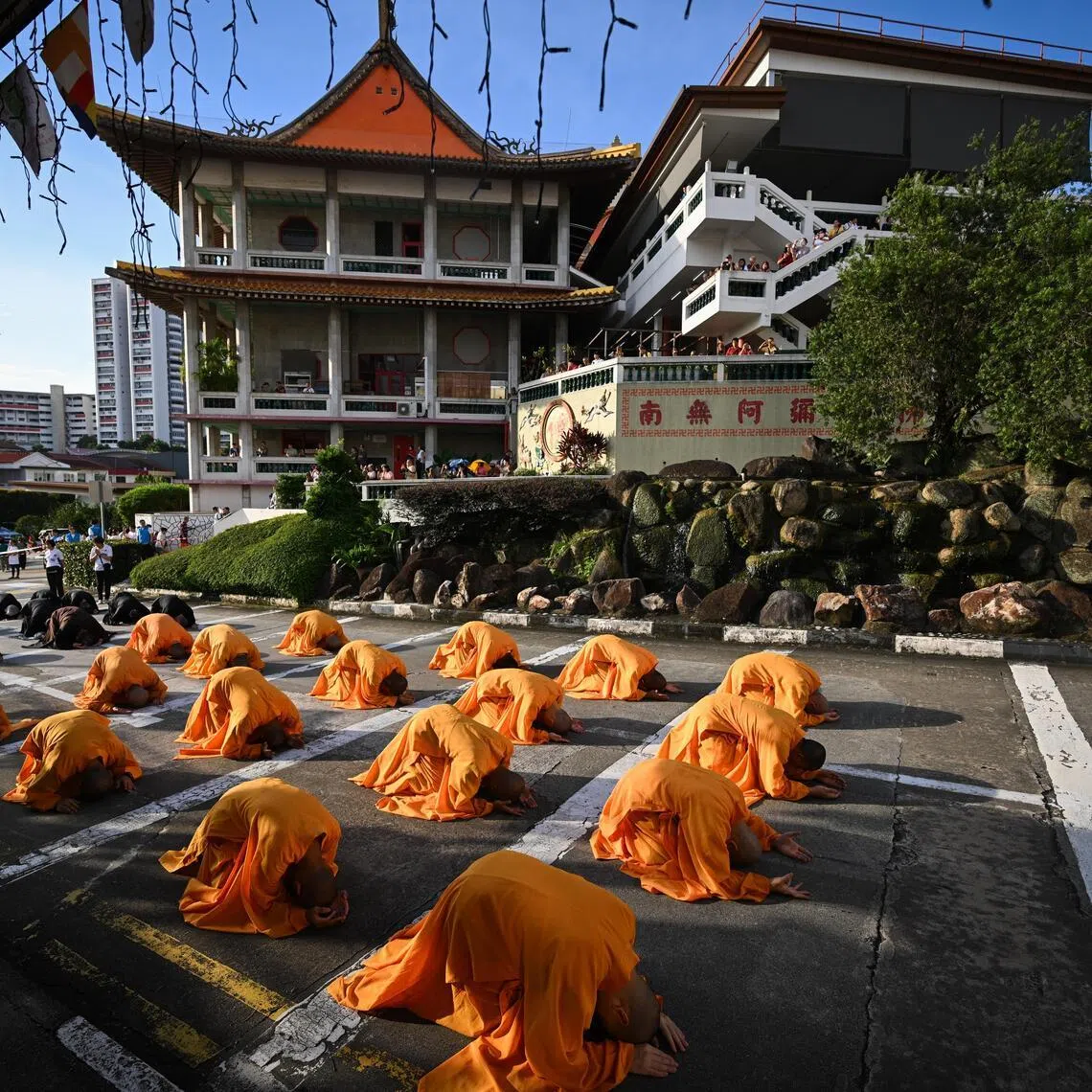 The monks leading the devotees near the Ancestral Hall.