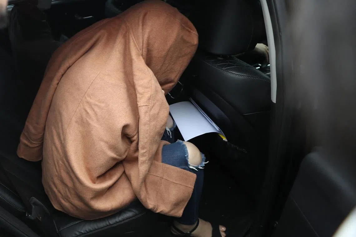 The 42-year-old woman, believed to be the mother of two children whose remains were found in suitcases in New Zealand, at Ulsan Central Police Station on Sept 15, 2022.