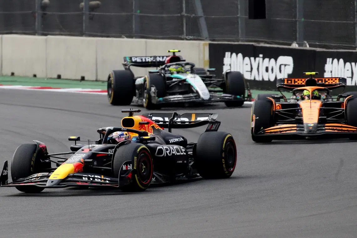 Red Bull's Max Verstappen and McLaren's Lando Norris in action during the Mexico City Grand Prix at the Autodromo Hermanos Rodriguez on Oct 27.