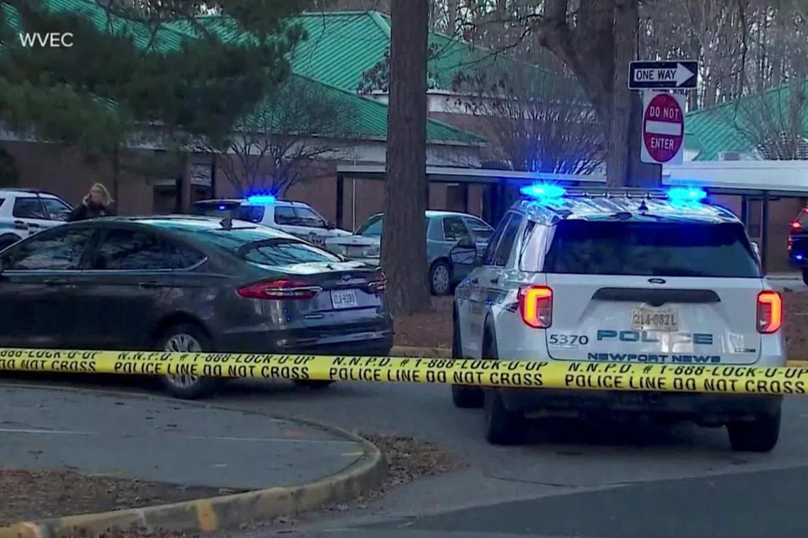 Police vehicles are seen parked outside Richneck Elementary School, where a six-year-old boy shot and wounded a teacher in Virginia, US. 