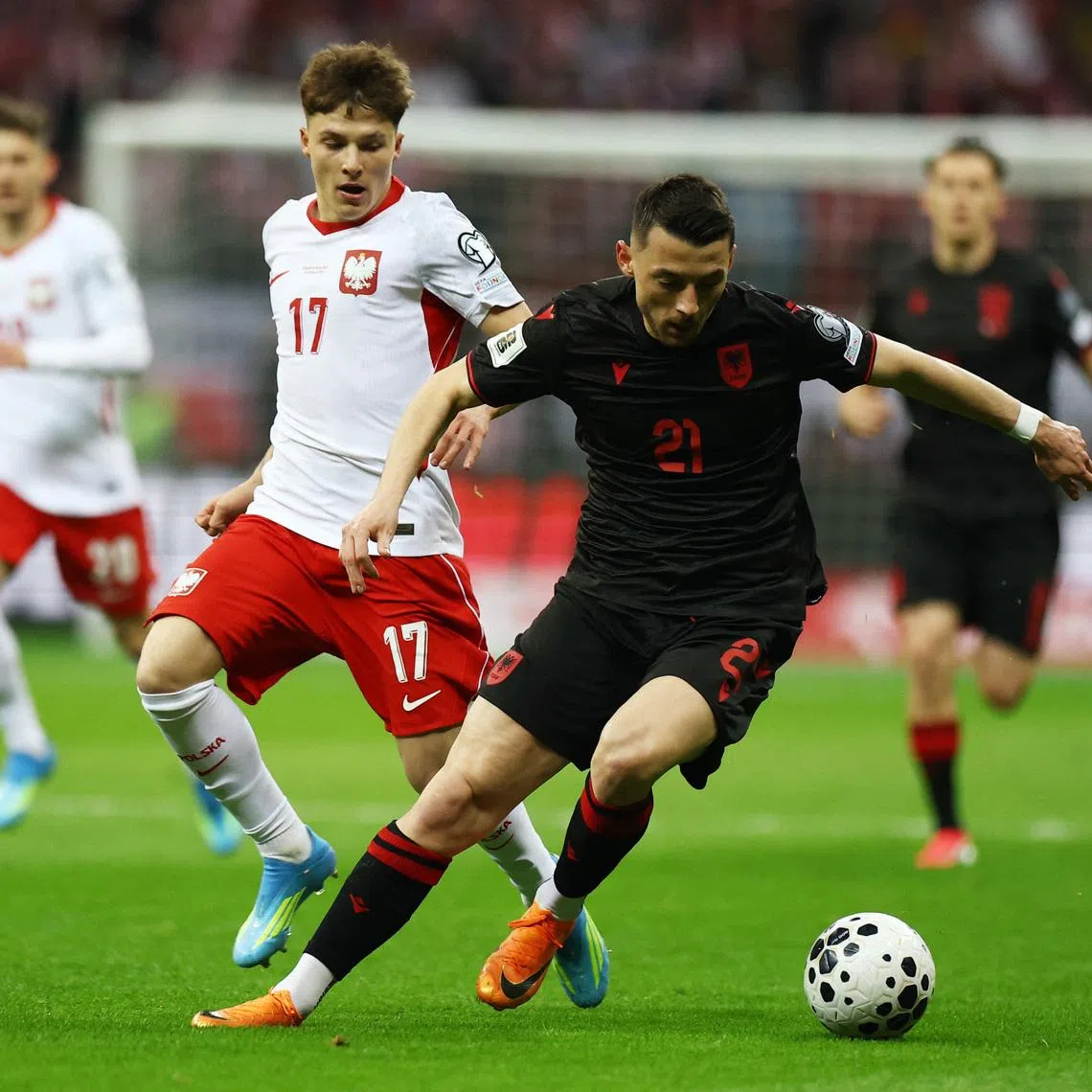 Soccer Football - FIFA World Cup - UEFA Qualifiers - Semi Final - Poland v Albania - PGE Narodowy, Warsaw, Poland - March 26, 2026 Albania's Arber Hoxha in action with Poland's Filip Kucharczyk REUTERS/Kacper Pempel