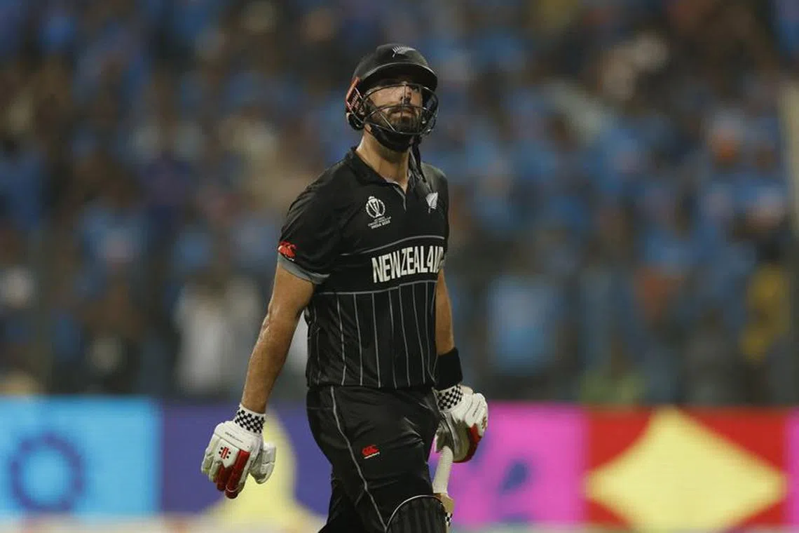 Cricket - ICC Cricket World Cup 2023 - Semi-Final - India v New Zealand - Wankhede Stadium, Mumbai, India - November 15, 2023 New Zealand's Daryl Mitchell walks back to the pavilion after losing his wicket, caught out by India's Ravindra Jadeja off the bowling of Mohammed Shami REUTERS/Adnan Abidi/File Photo