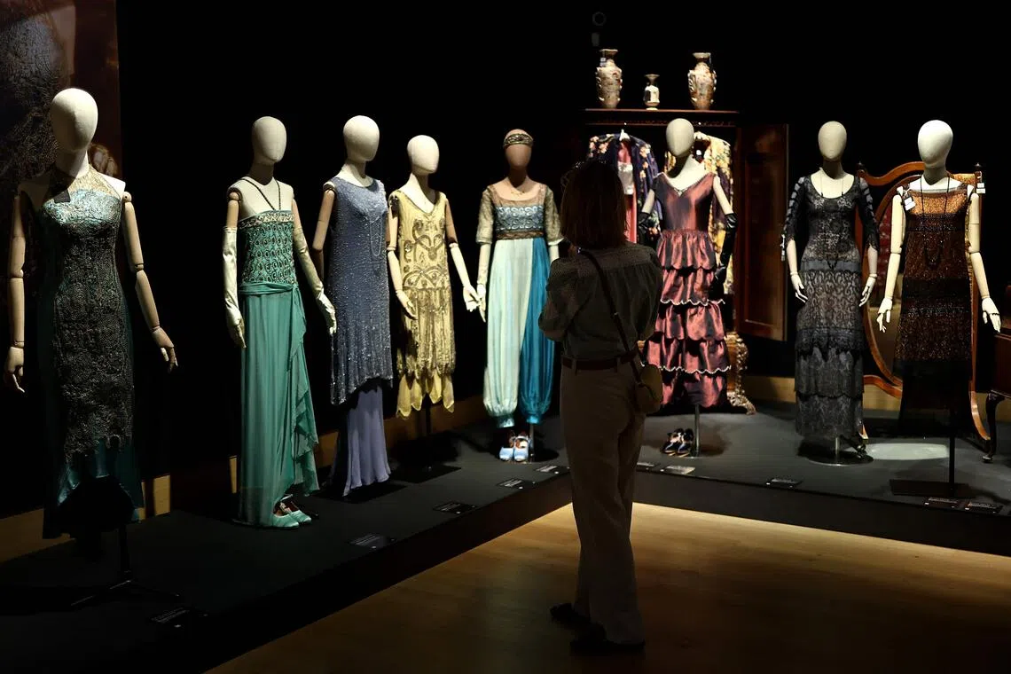 A collection of dresses belonging to characters from the Downton Abbey TV and film series during a press preview for an exhibition of of props, costumes and other items from the franchise before they go to auction, in central London on Aug 8, 2025. 
