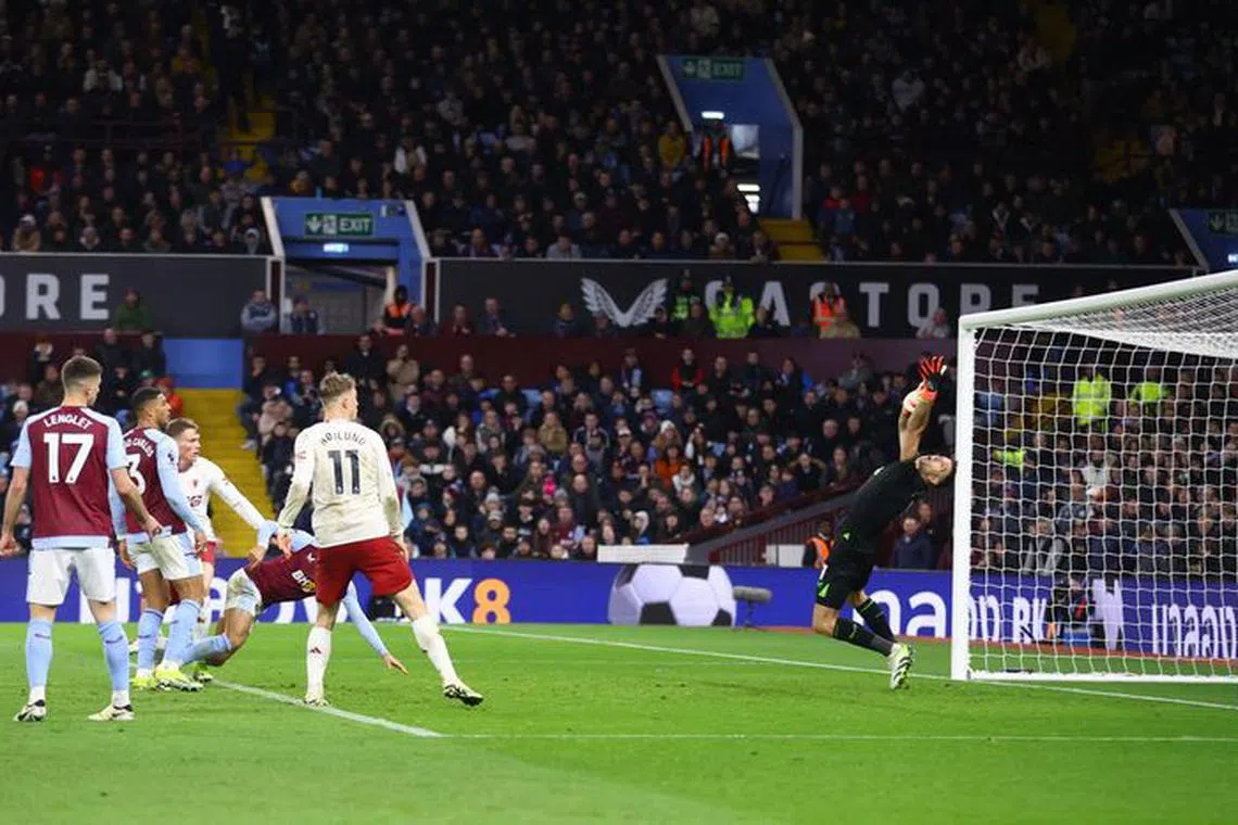 Soccer Football - Premier League - Aston Villa v Manchester United - Villa Park, Birmingham, Britain - February 11, 2024 Manchester United's Scott McTominay scores their second goal past Aston Villa's Emiliano Martinez REUTERS/Carl Recine