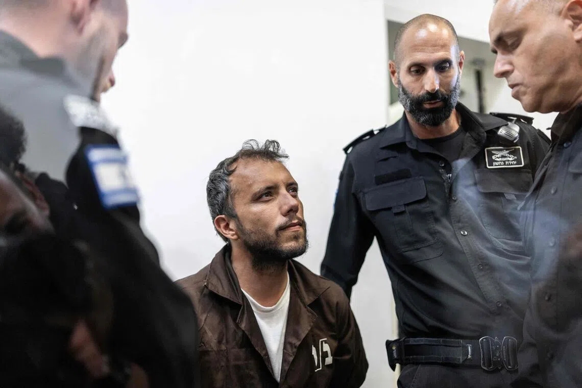 Brazilian activist Thiago Avila being escorted into court in the Israeli coastal city of Ashkelon on May 5.