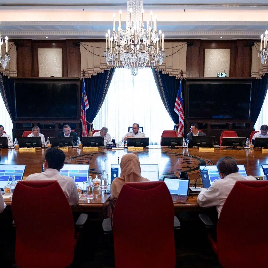 Malaysia's Prime Minister Anwar Ibrahim (centre) is facing calls to speed up reforms after three years in government.