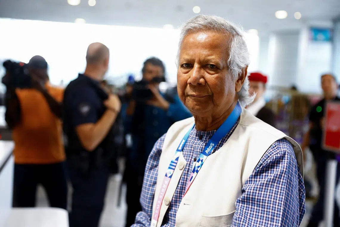 FILE PHOTO: Nobel laureate Muhammad Yunus, who was recommended by Bangladeshi student leaders as the head of the interim government in Bangladesh, stands at Paris Charles de Gaulle airport in Roissy-en-France, France August 7, 2024. REUTERS/Abdul Saboor/File Photo