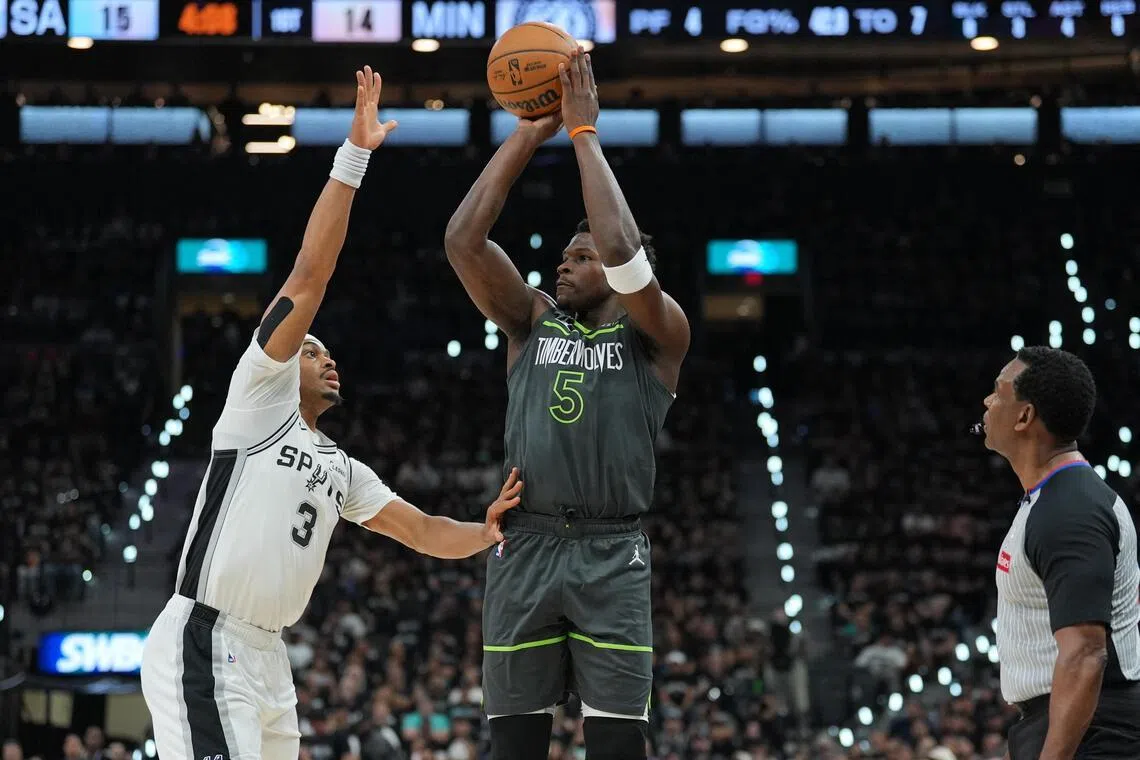 Minnesota Timberwolves star Anthony Edwards shooting over Keldon Johnson of the San Antonio Spurs during the Spurs' 133-95 home win in their NBA play-off series on May 6.