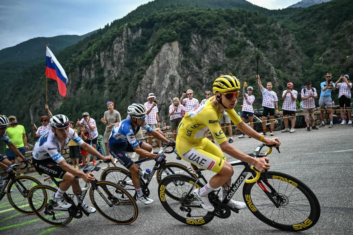UAE Team Emirates' Slovenian rider Tadej Pogacar wearing the overall leader's yellow jersey during the 19th stage of the Tour de France.