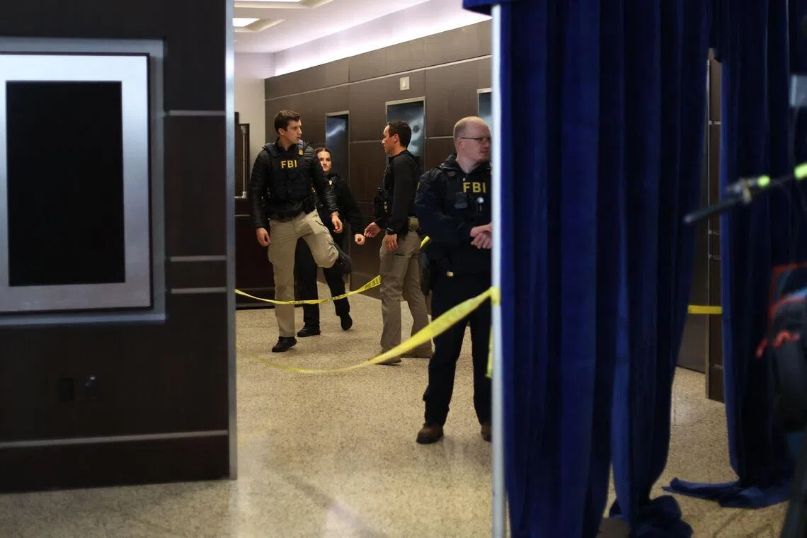 FBI agents are seen at the Washington Hilton after shots were fired during the White House Correspondents dinner on April 25, 2025.  