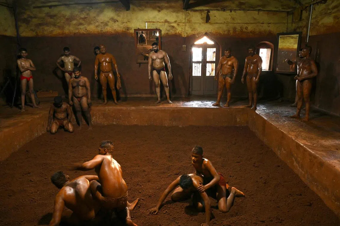 India's mud wrestling, known as “kushti” or “dangal”, has millennia-old roots but emerged during the period of India’s Mughal rulers in the 16th century, blending traditional hand-to-hand combat with Persian martial arts.