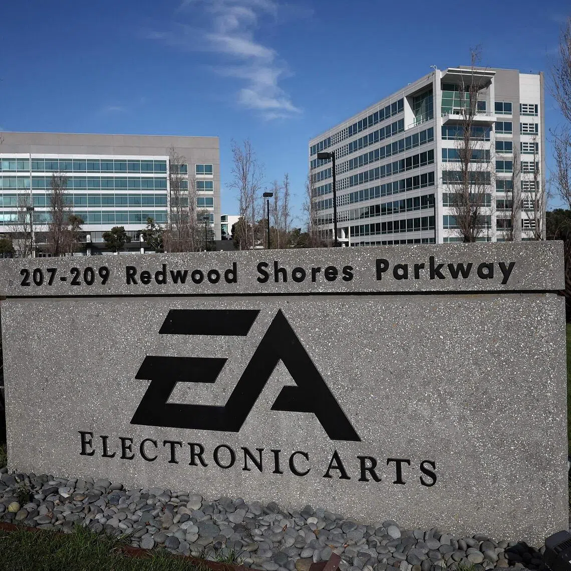 (FILES) A sign is posted in front of the Electronic Arts (EA) headquarters on January 30, 2024 in Redwood City, California. Video game maker Electronic Arts will report third quarter earnings today after the closing bell. Electronic Arts on on February 28, 2024 said it is cutting about 5 percent of its workforce, as belt tightening continues in the video game and tech industries. (Photo by JUSTIN SULLIVAN / GETTY IMAGES NORTH AMERICA / AFP)