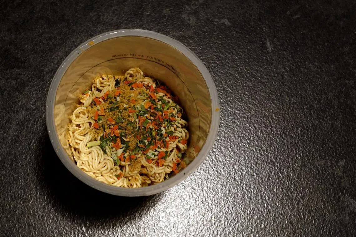 Serving the hot noodle cups to tightly seated economy class passengers will stop from Aug 15. 