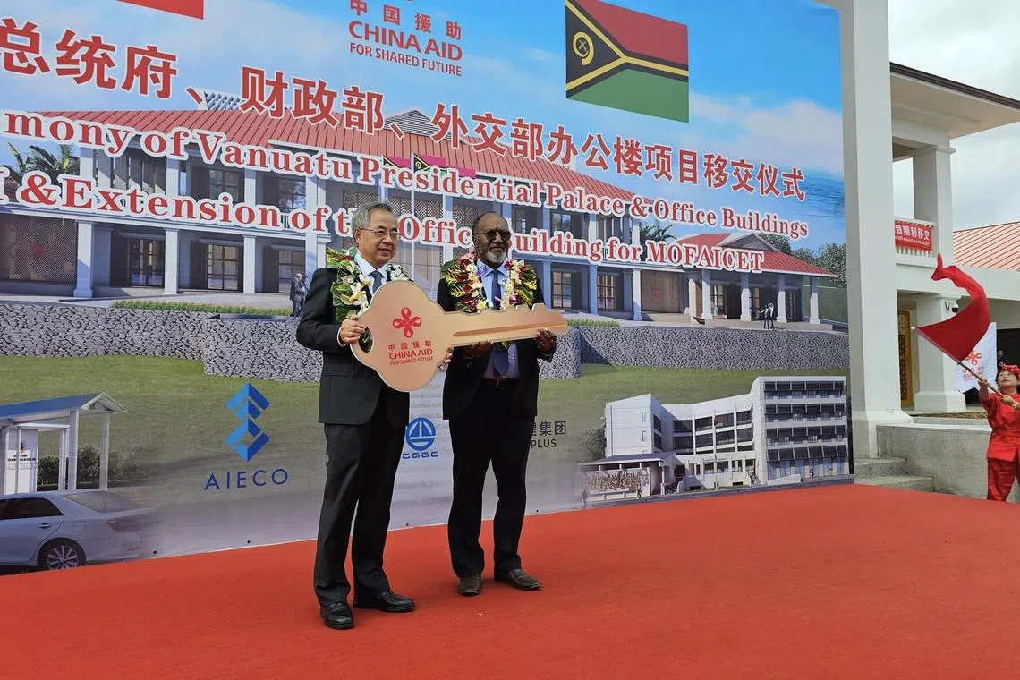 A Chinese delegation handed Mr Salwai an oversized novelty golden key – also emblazoned with “China Aid”.
