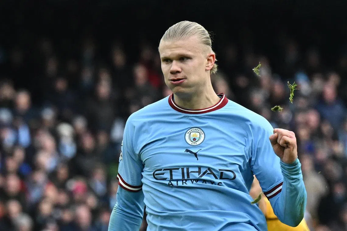 Manchester City's Erling Haaland celebrates after scoring his second goal against Wolves.
