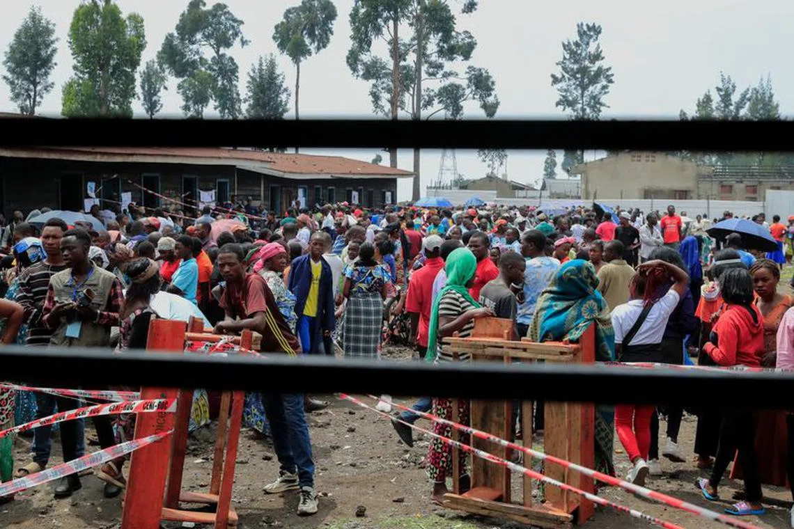 Internally displaced Congolese people gather to vote at the Kanyaruchinya polling centre, during the Presidential election, at the Kanyaruchinya site for displaced people, in Nyiragongo territory, near Goma in North Kivu province of the Democratic Republic of Congo December 20, 2023. REUTERS/Thomas Mukoya