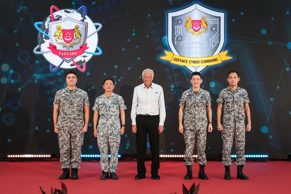 Defence Minister Ng Eng Hen with (from left) Commander of SAF C4 and Digitalisation Command Wong Hong Kai; Chief of Defence Force Aaron Beng; Chief of Digital and Intelligence Service Lee Yi-Jin; and Commander of Defence Cyber Command Clarence Cai on March 18.