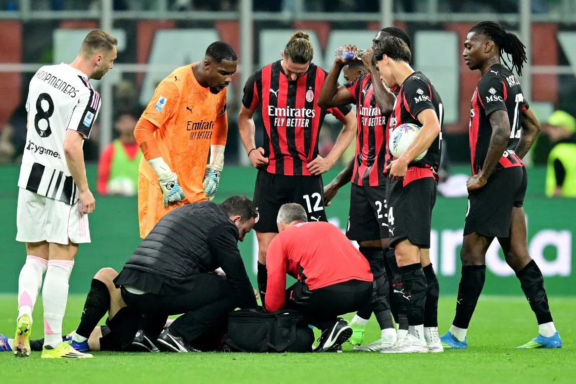 Soccer Football - Serie A - AC Milan v Juventus - San Siro, Milan, Italy - April 26, 2026 AC Milan's Luka Modric receives medical attention after sustaining an injury REUTERS/Daniele Mascolo