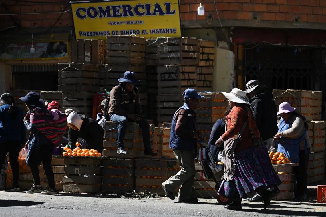 People visit a market to stock up on food and other supplies as Bolivia's crisis begins to ease after lawmakers backed the state of emergency, in El Alto, Bolivia, June 21, 2026. REUTERS/Claudia Morales