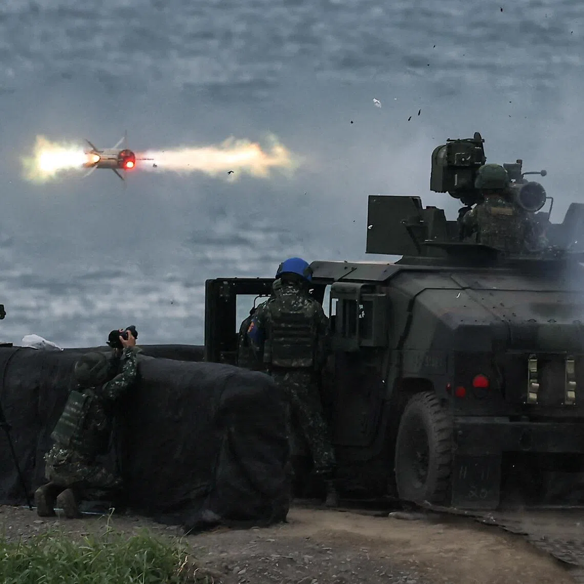 A US-made TOW-2A wire-guided anti-tank missile is launched by Taiwanese soldiers at training grounds in Pingtung.