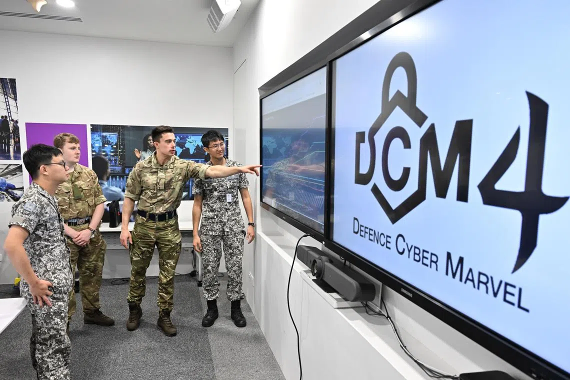 The joint British Army and the Digital and Intelligence Service team planning their defence strategy during the Defence Cyber Marvel.
