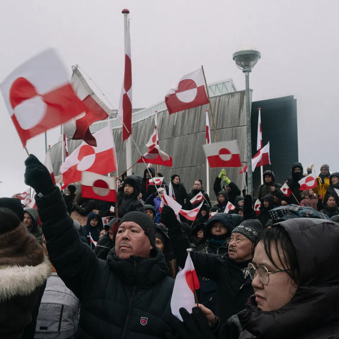 Crowds gather and wave the flag of Greenland to protest US President Donald’s proposal to take over Greenland, in Nuuk, on Jan 17.