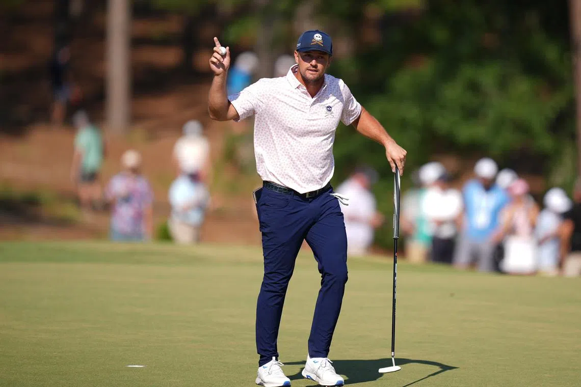 Jun 15, 2024; Pinehurst, North Carolina, USA; Bryson DeChambeau reacts after putting on the fifth hole during the third round of the U.S. Open golf tournament. Jim Dedmon-USA TODAY Sports