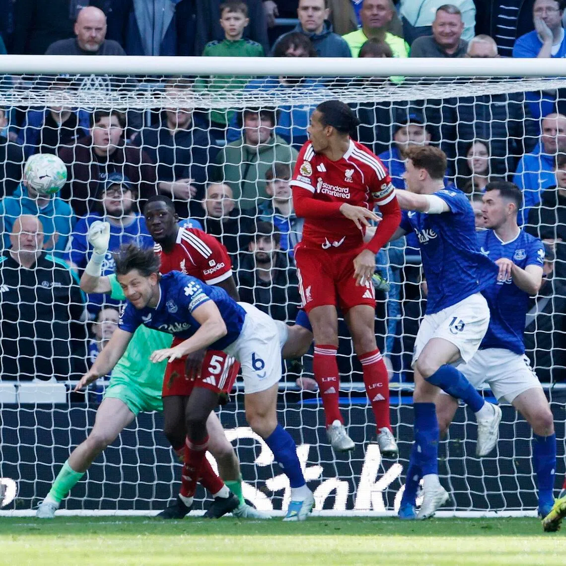 Liverpool's Virgil van Dijk scores their second goal in the 2-1 Premier League win over Everton.