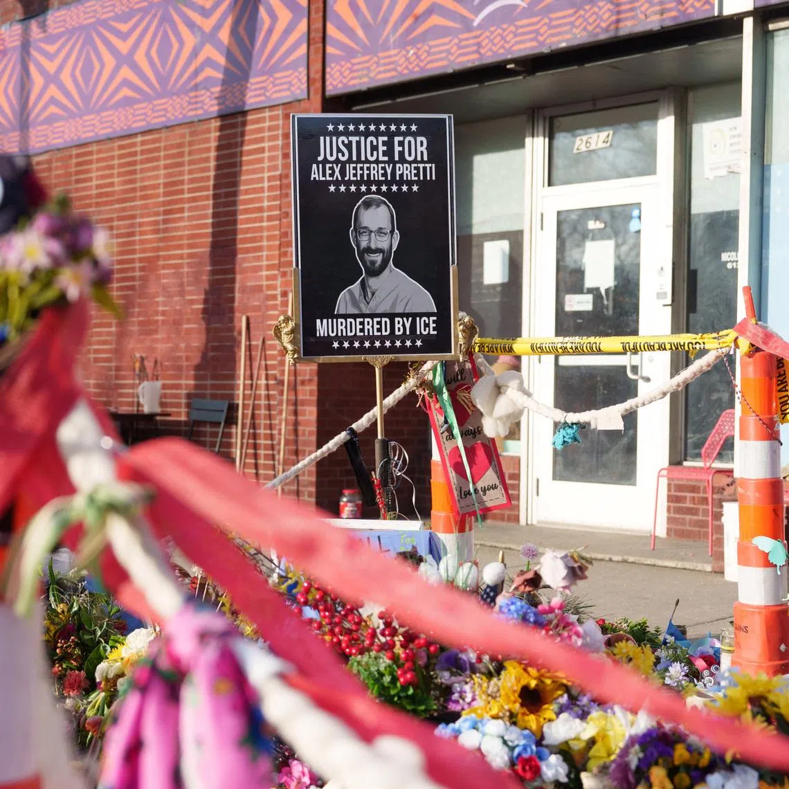 A sign showing Alex Pretti at a memorial in Minneapolis, Minnesota, U.S., March 12, 2026. REUTERS/Tim Evans