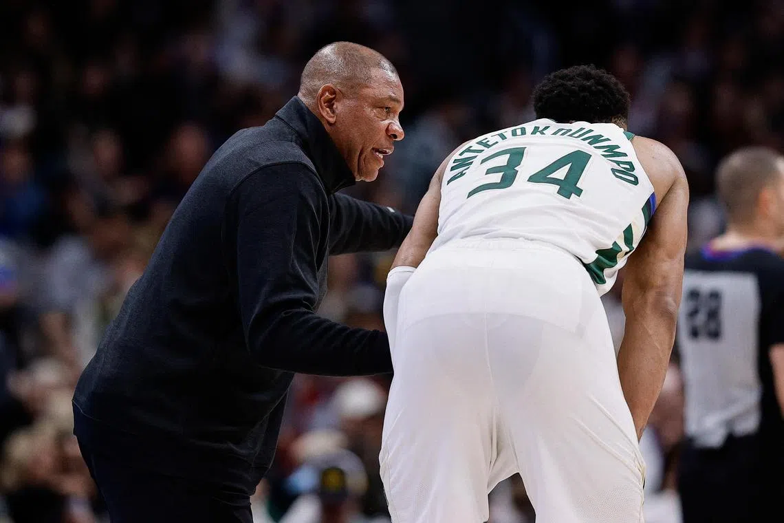 Milwaukee Bucks head coach Doc Rivers talks to star forward Giannis Antetokounmpo in the fourth quarter against the Denver Nuggets at Ball Arena.