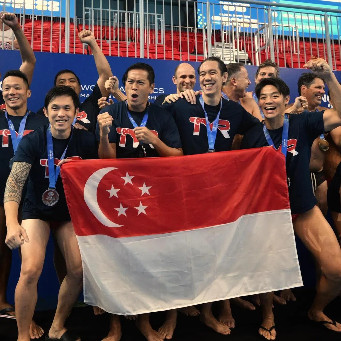 Merlion Masters B celebrating their World Aquatics Masters Championships water polo men's 40+ silver at the WCH Arena on Aug 22, 2025.