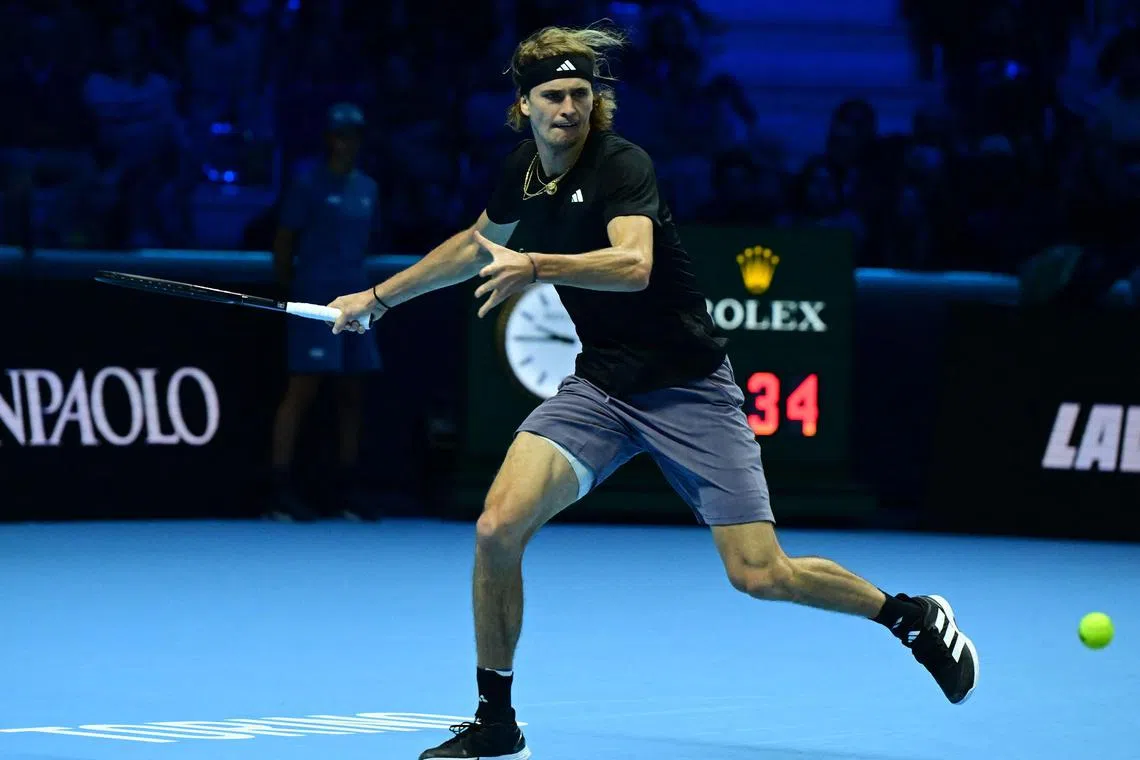 Germany's Alexander Zverev returns the ball to Russia's Daniil Medvedev during their round-robin match at the ATP Finals.