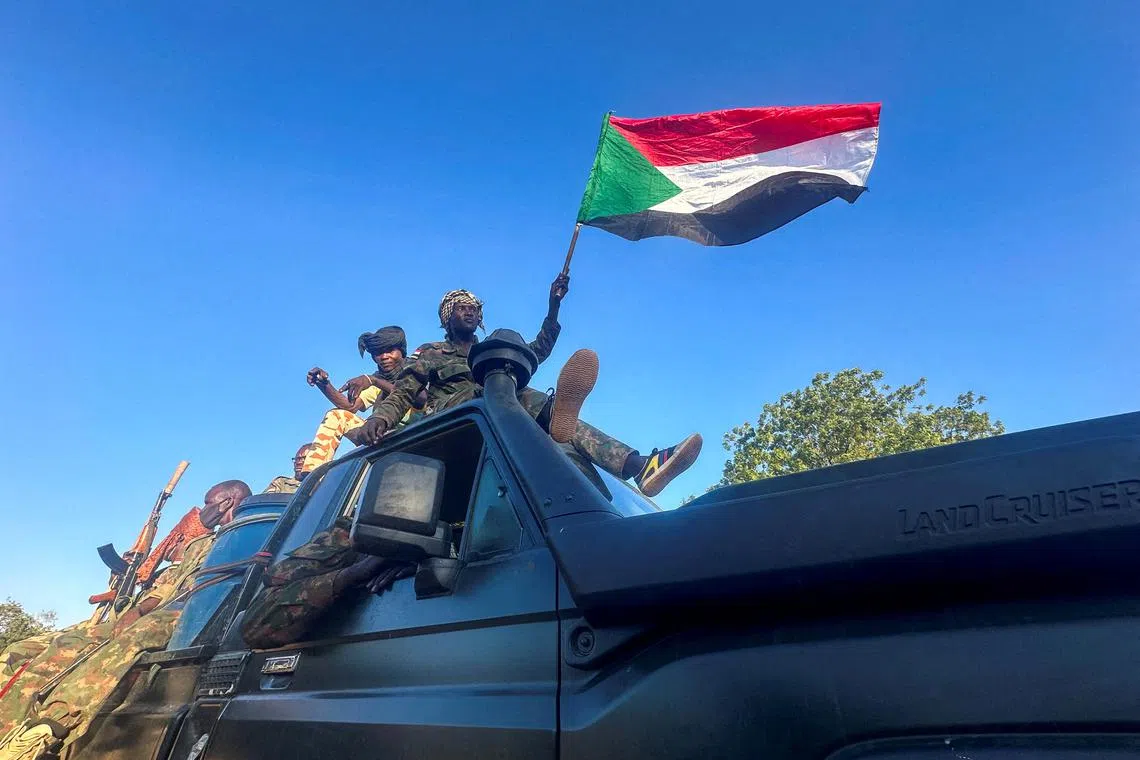 FILE PHOTO: Sudan's army soldiers celebrate after entering Wad Madani, in Sudan, January 12, 2025. REUTERS/El Tayeb Siddig/File Photo