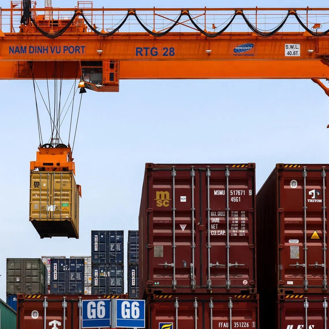 A container is loaded onto a cargo ship while docked at Hai Phong port in Hai Phong, Vietnam, April 16, 2025. REUTERS/Athit Perawongmetha
