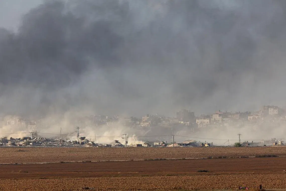 Smoke rises over Gaza, amid the ongoing conflict between Israel and the Palestinian Islamist group Hamas, as seen from southern Israel, December 9, 2023. REUTERS/Athit Perawongmetha
