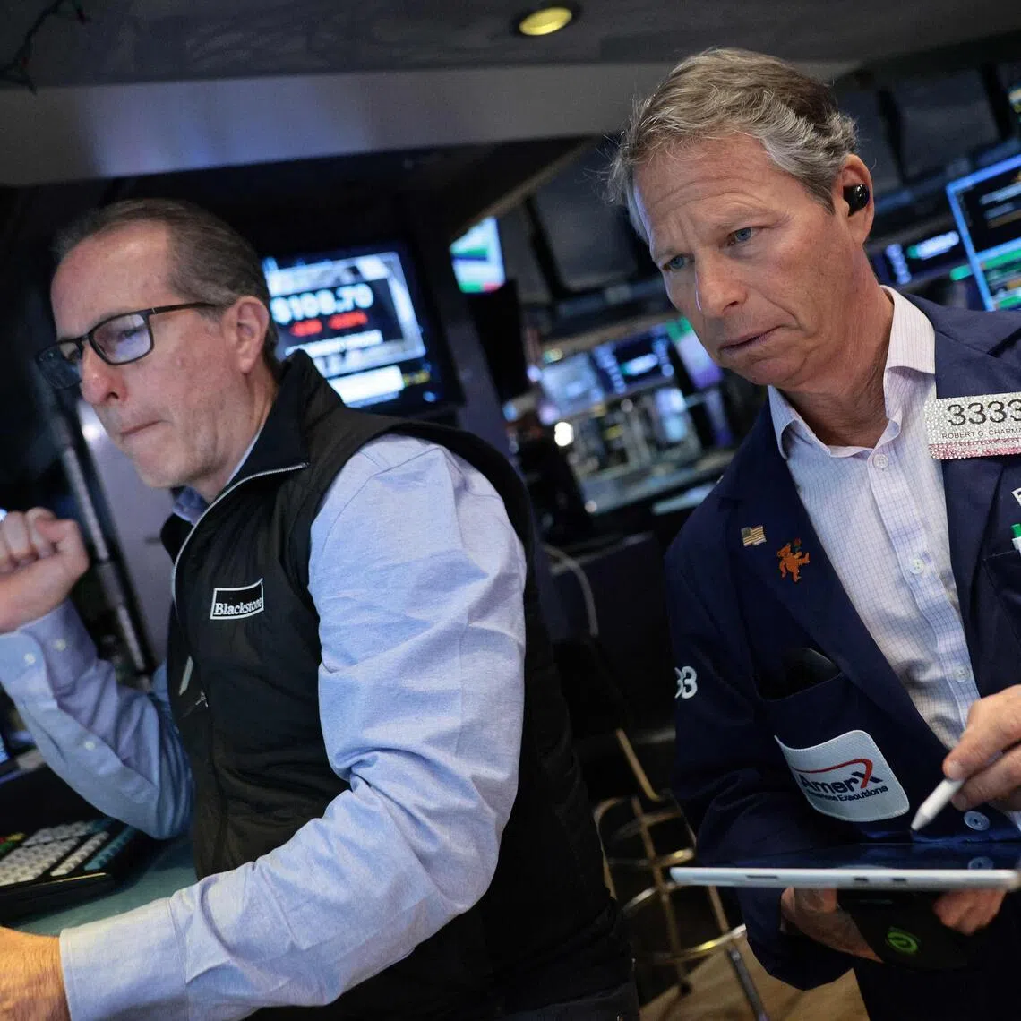 Traders working on the floor of the New York Stock Exchange during morning trading on May 20, in New York City.