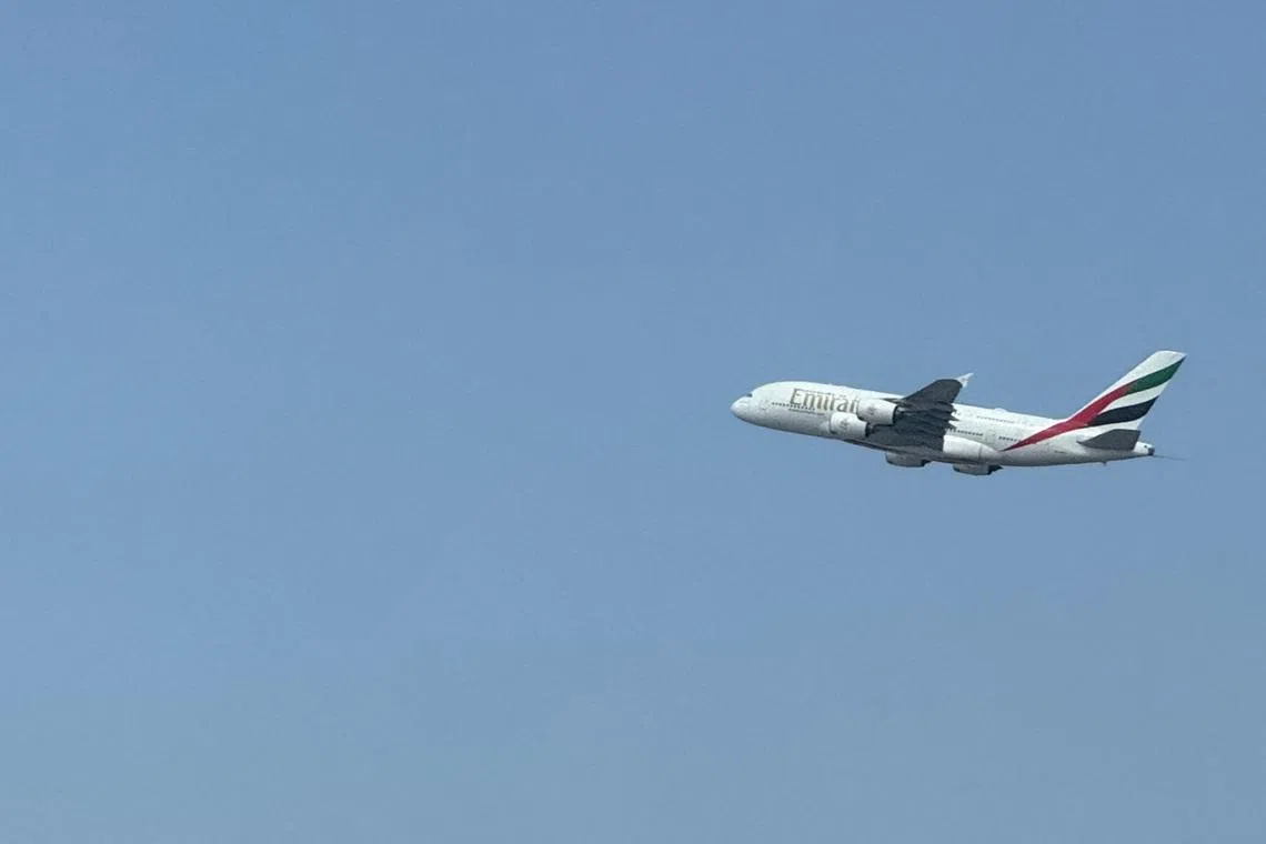 An Emirates flight takes off from Dubai International Airport, amid the U.S.-Israeli conflict with Iran, in Dubai, United Arab Emirates, March 7, 2026. REUTERS/Stringer