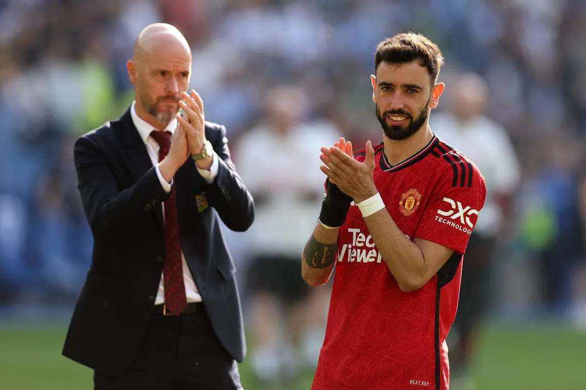 Soccer Football - Premier League - Brighton & Hove Albion v Manchester United - The American Express Community Stadium, Brighton, Britain - May 19, 2024  Manchester United's Bruno Fernandes and manager Erik ten Hag applaud fans after the match REUTERS/David Klein/File Photo