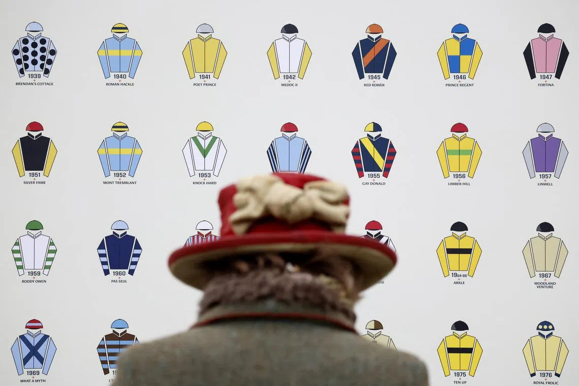 Horse Racing - Cheltenham Festival - Cheltenham Racecourse, Cheltenham, Britain - March 12, 2024  General view of a board showing jockeys from the last 100 years Action Images via Reuters/Peter Cziborra