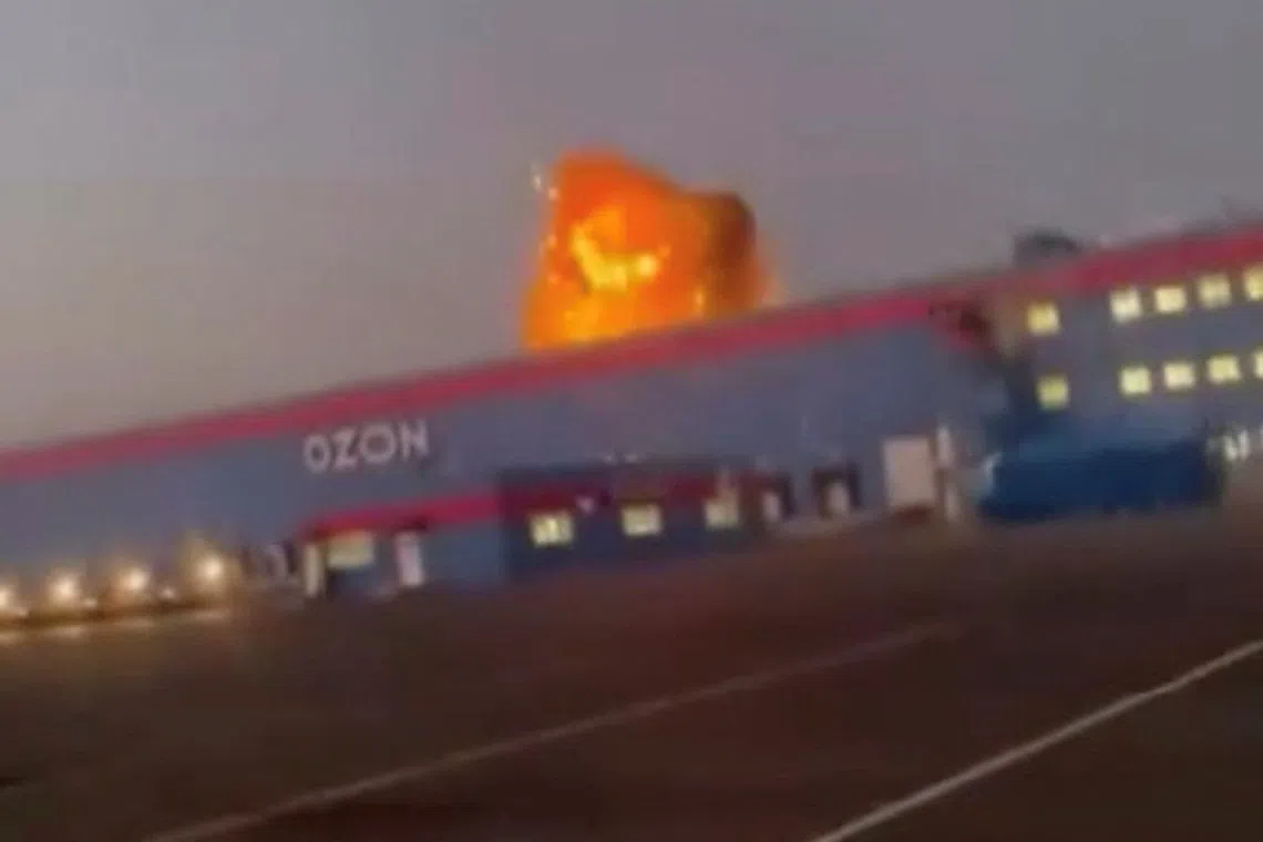 A screengrab shows flames rising from an Ozon facility following a Ukrainian drone strike, in Makhachkala, Dagestan, Russia.