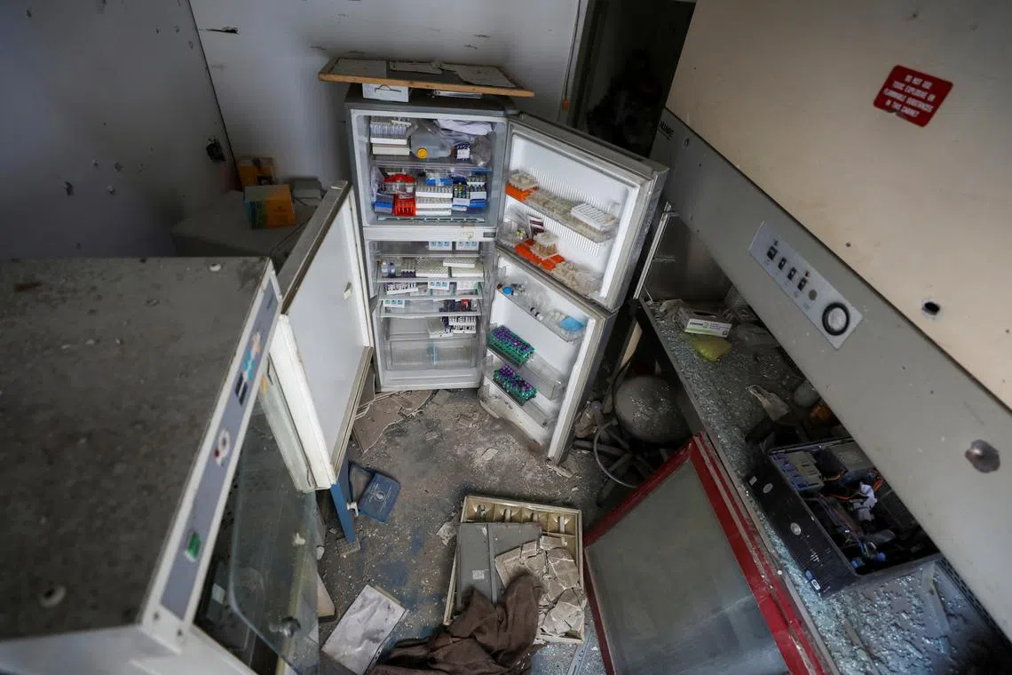 Tubes of specimens lie inside a broken fridge inside Al Basma IVF Centre, Gaza's largest fertility clinic which was struck in an Israeli shell during the ongoing conflict between Israel and the Palestinian Islamist group Hamas, in Gaza City, April 2, 2024. REUTERS/Dawoud Abu Alkas