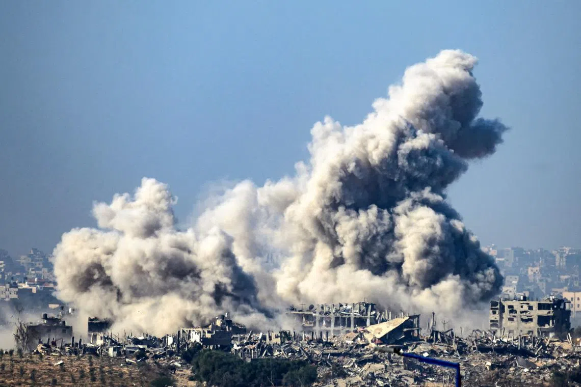 A photo taken from southern Israel, near the border with the Gaza Strip, shows smoke rising from buildings hit by Israeli strikes.
