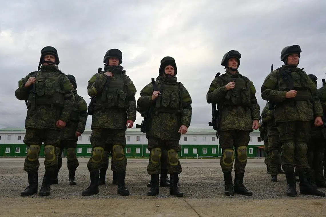 FILE PHOTO: Russian reservists recruited during the partial mobilisation of troops attend a ceremony before departing to the zone of Russia-Ukraine conflict, in the Rostov region, Russia October 31, 2022. REUTERS/Sergey Pivovarov/File Photo