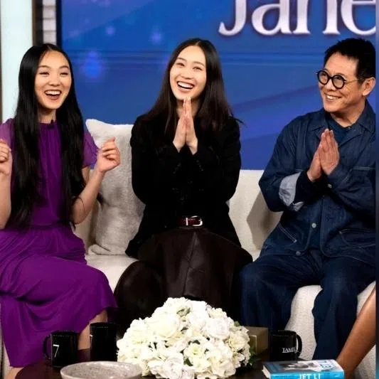Martial arts star Jet Li (right) with his daughters Jane (left) and Jada on the Tamron Hall Show.