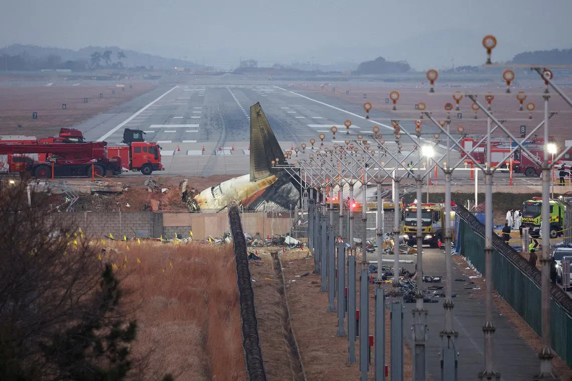 FILE PHOTO: The wreckage of the Jeju Air aircraft that went off the runway and crashed lies at Muan International Airport, in Muan, South Korea, December 30, 2024. REUTERS/Kim Hong-Ji/File Photo/File Photo