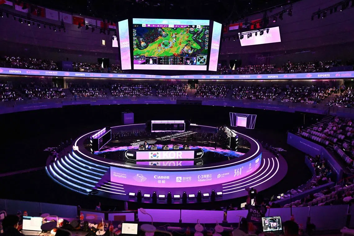 Teams from South Korea (centre) and Taiwan (right) prepare to compete in the e-sports League of Legends final match, during the Hangzhou 2022 Asian Games in China.