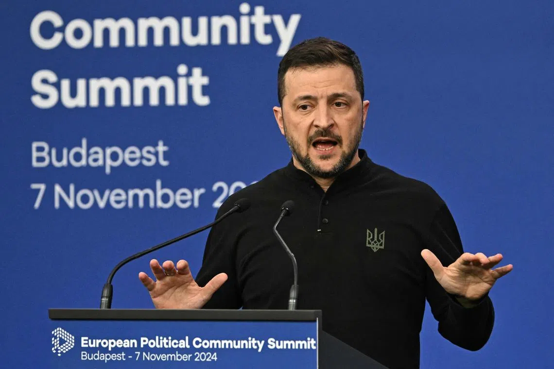 Ukraine's President Volodymyr Zelensky gives a press conference at the European Political Community Summit in Budapest, Hungary, on November 7, 2024. (Photo by Attila KISBENEDEK / AFP)