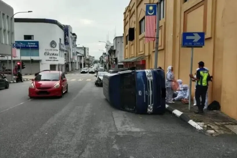 The van collided with a car at a traffic light intersection in Ipoh, Malaysia.