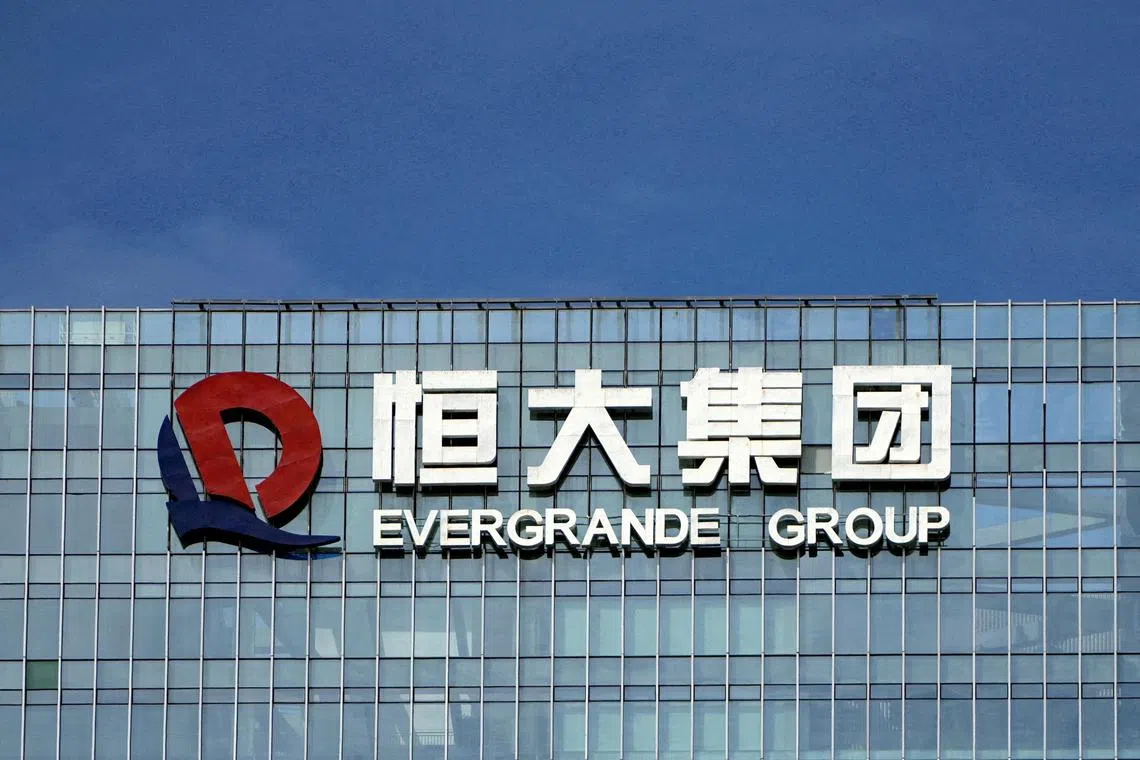 FILE PHOTO: The company logo is seen on the headquarters of China Evergrande Group in Shenzhen, Guangdong province, China September 26, 2021. REUTERS/Aly Song/File Photo